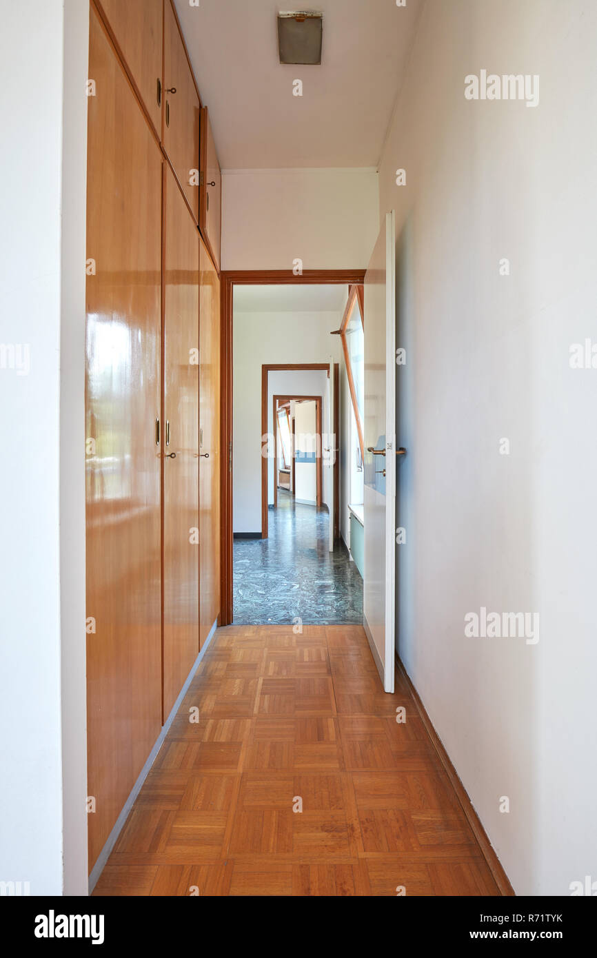 Corridor, room interior with wooden wardrobe in country house Stock Photo