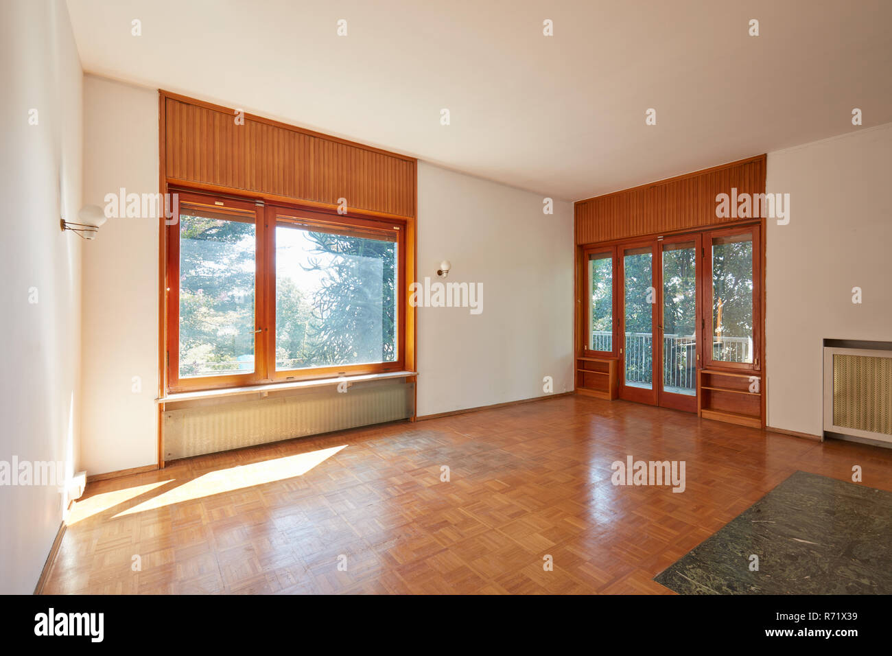 Old room, living room interior in old house with garden, wooden floor Stock Photo