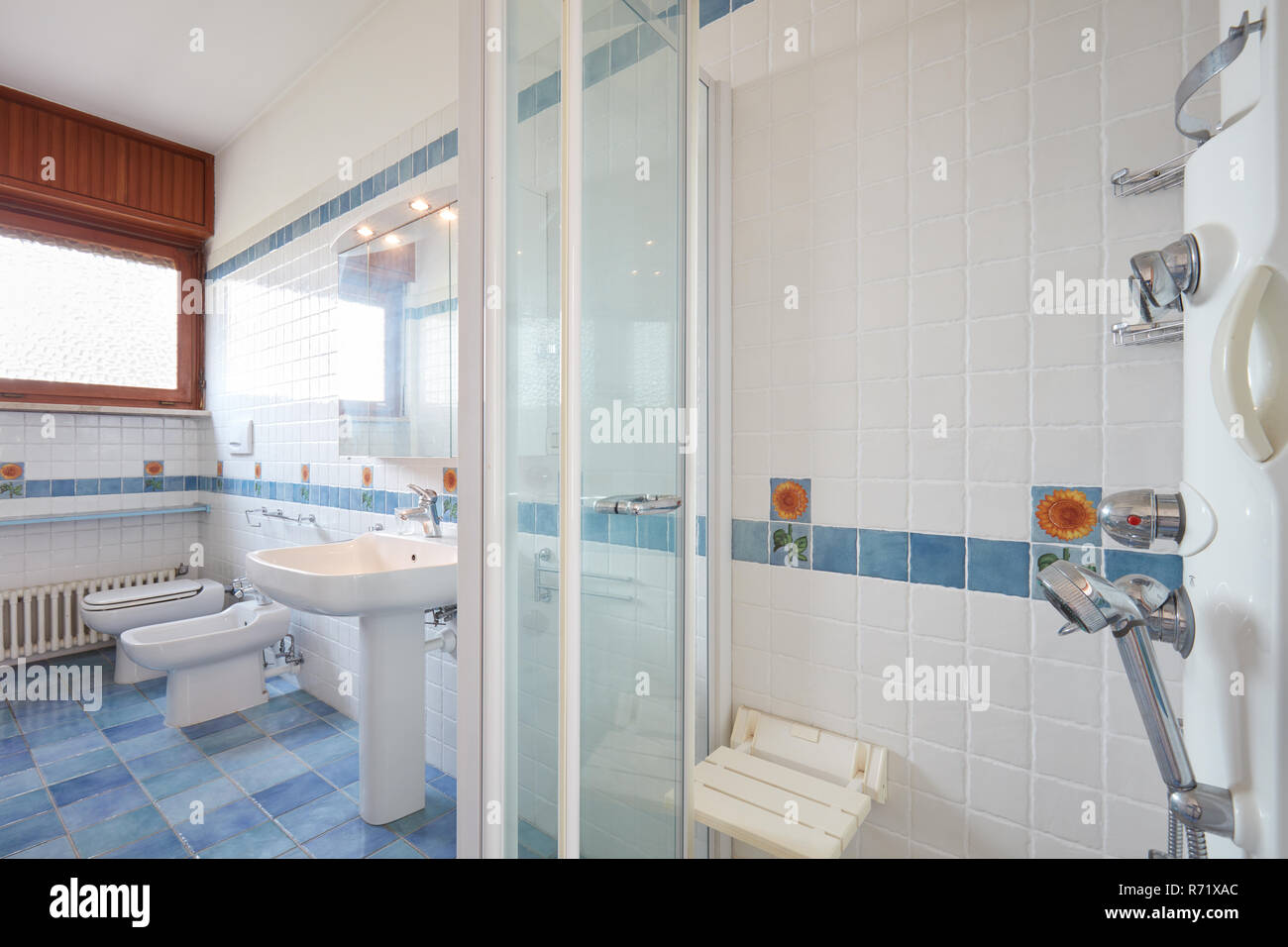 Normal bathroom with large shower in apartment interior Stock Photo