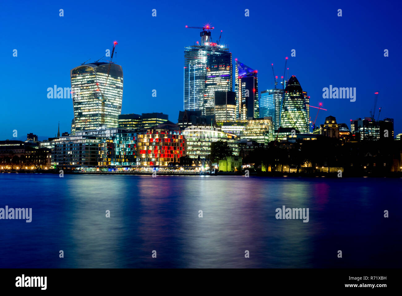 The City of London skyline and River Thames at night. Stock Photo