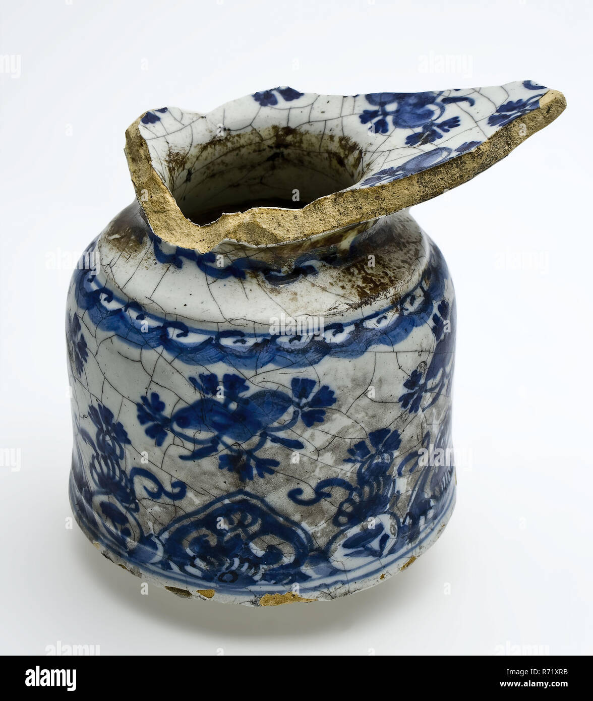 Faience spittoon with blue decor on white ground, flower figures and