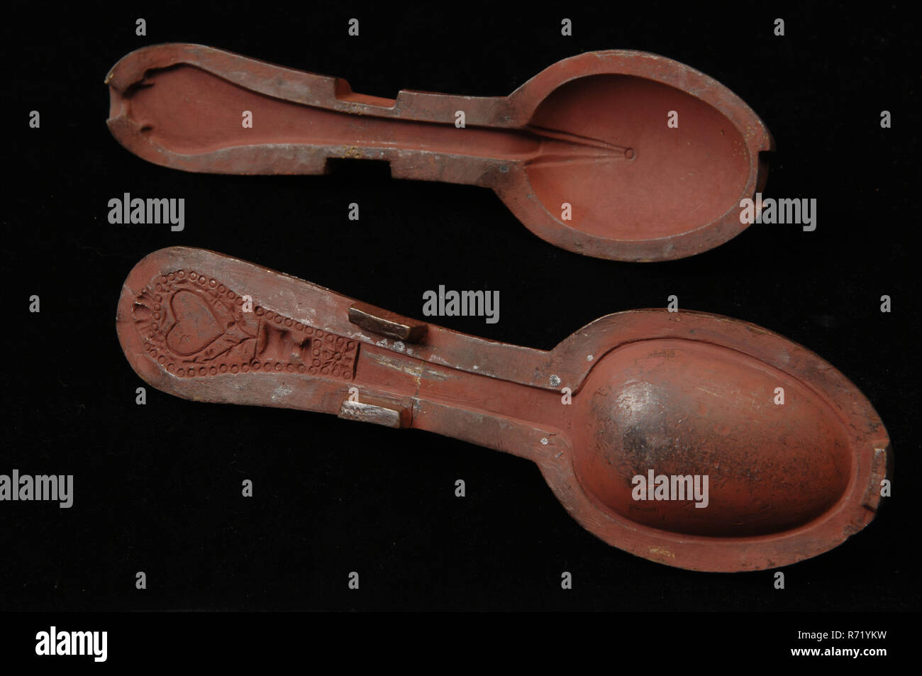 Twopiece bronze mold for wedding spoon with decoration, mold casting