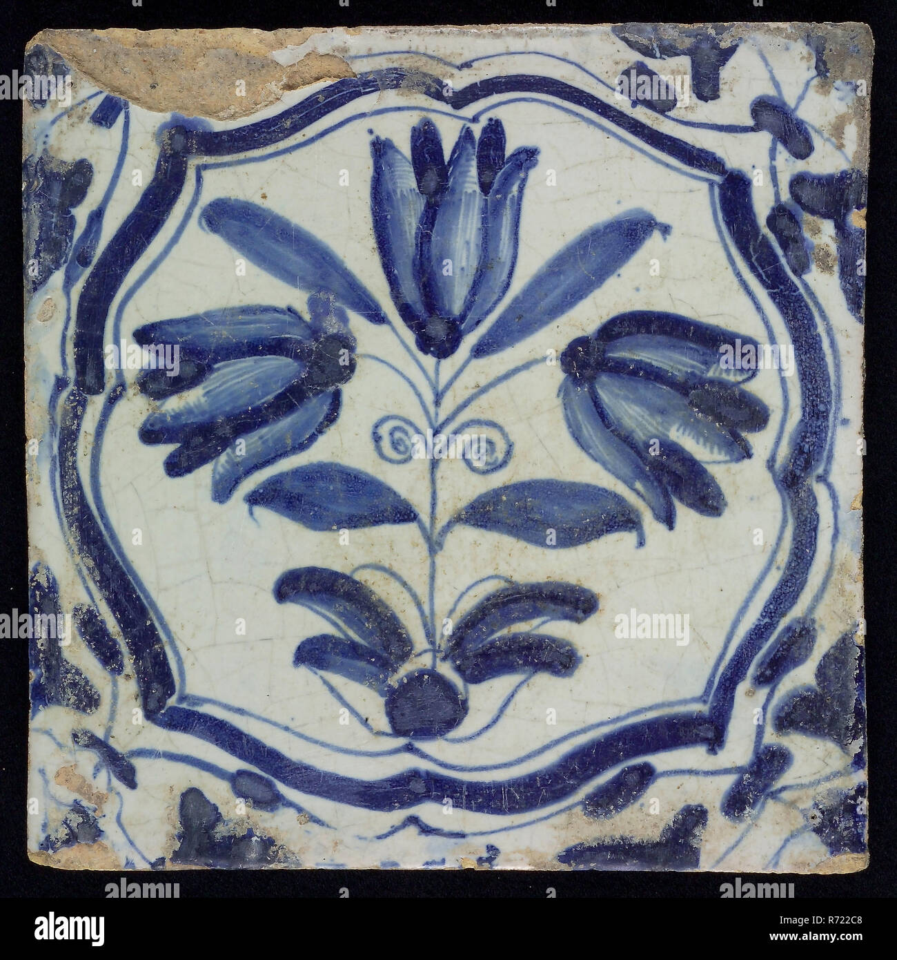 Flower Tile, three-tier in brace frame, blue decor on white ground, corner fill: voluten, marked, wall tile tile sculpture ceramic earthenware enamel tinglage h 12.7, first letter is partly gone Rotterdam City Triangle Zandstraat indigenous pottery Probably from the vicinity of the Zandstraat Rotterdam. Stock Photo