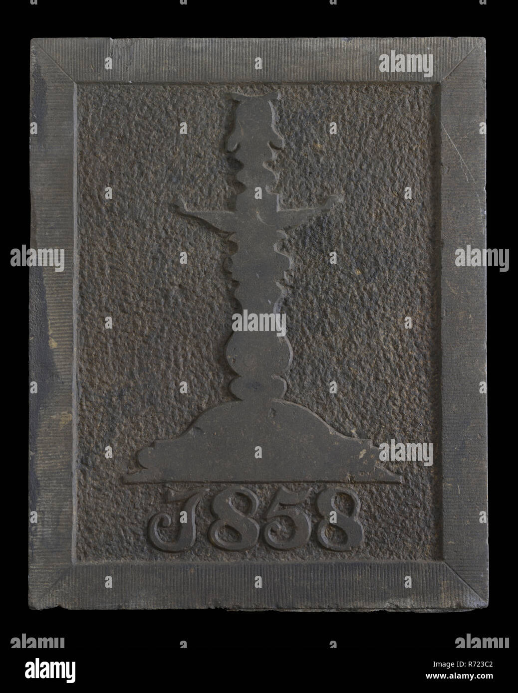 Facing brick with candlestick and year 1858, facing stone sculpture