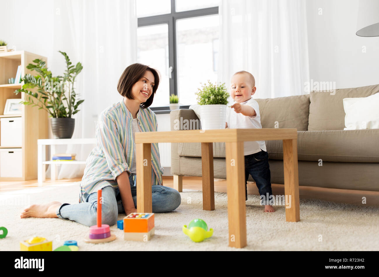 happy mother with little baby boy playing at home Stock Photo - Alamy