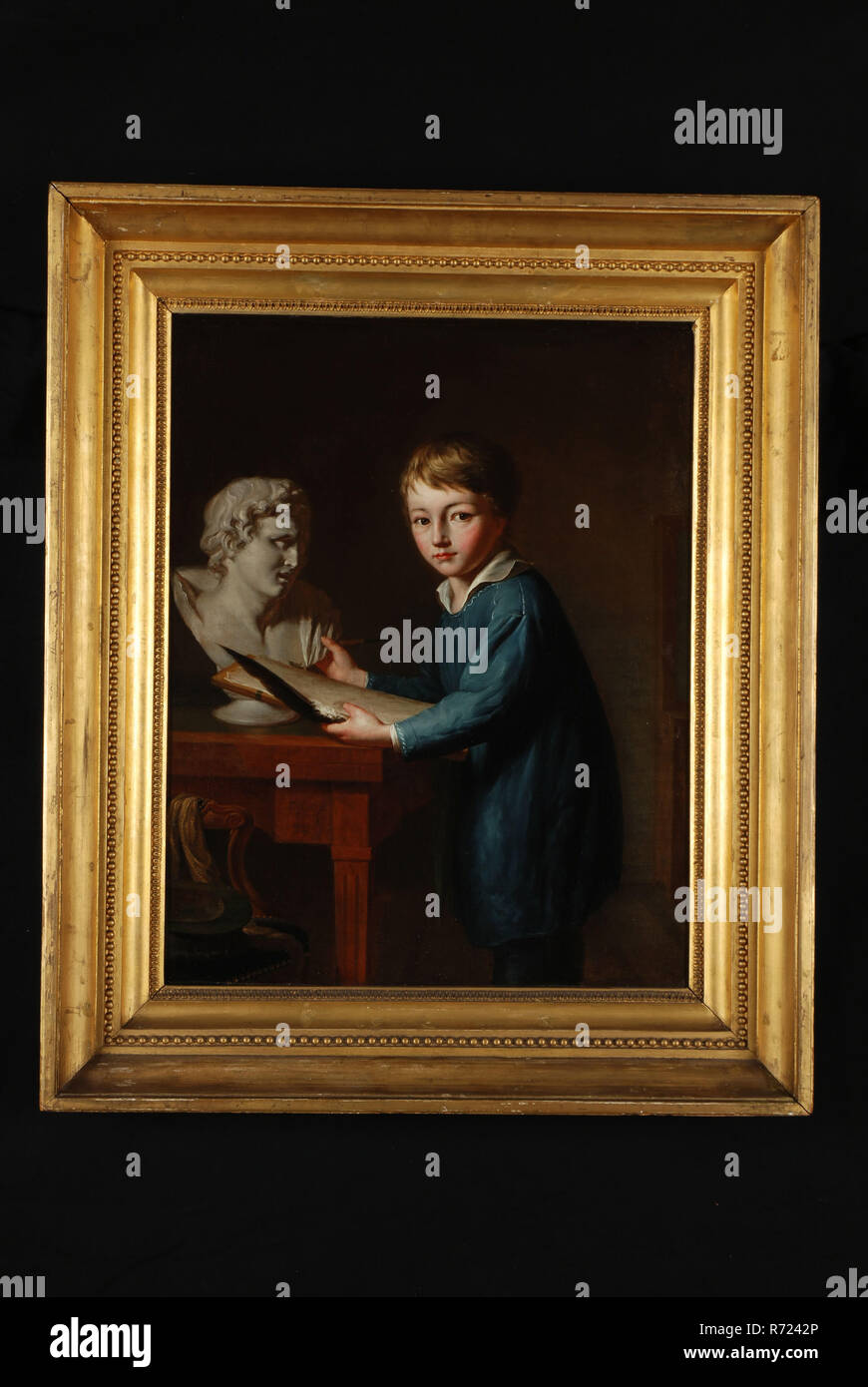 François Montauban van Swijndregt, Portrait of Charles Rochussen at the age of 11, portrait painting material linen oil painting, Portrait portrait of boy representing the painter Charles Rochussen as child (11 years old). With drawing pen (chalk) wiper (feather) and drawing board dressed in kind of painter's jacket and standing at table on which man's bust; in the foreground on the left in front of the table chair with scarf and fancy hat . In original gilded baklijst Painting of signature and year on edge: F.M.v.S. inV: & Fft 1825 children's portrait knee painting drawing drawing instruction Stock Photo