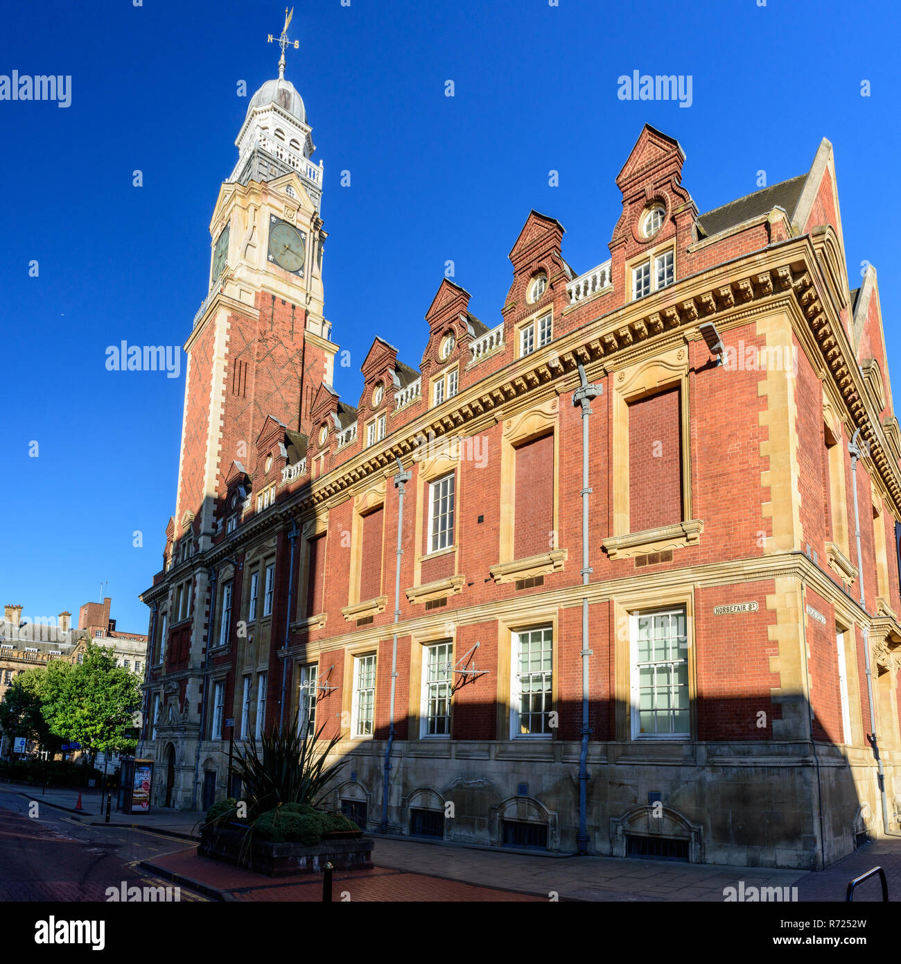 Leicester, England, UK - July 3, 3018: Evening sun shines on the exterior and clock tower of the Town Hall, the Baroque Queen Anne revival-style seat  Stock Photo