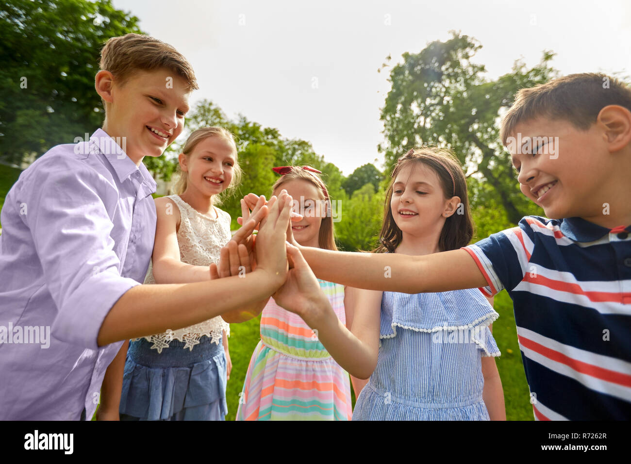 Kids Team High Five High Resolution Stock Photography and Images - Alamy