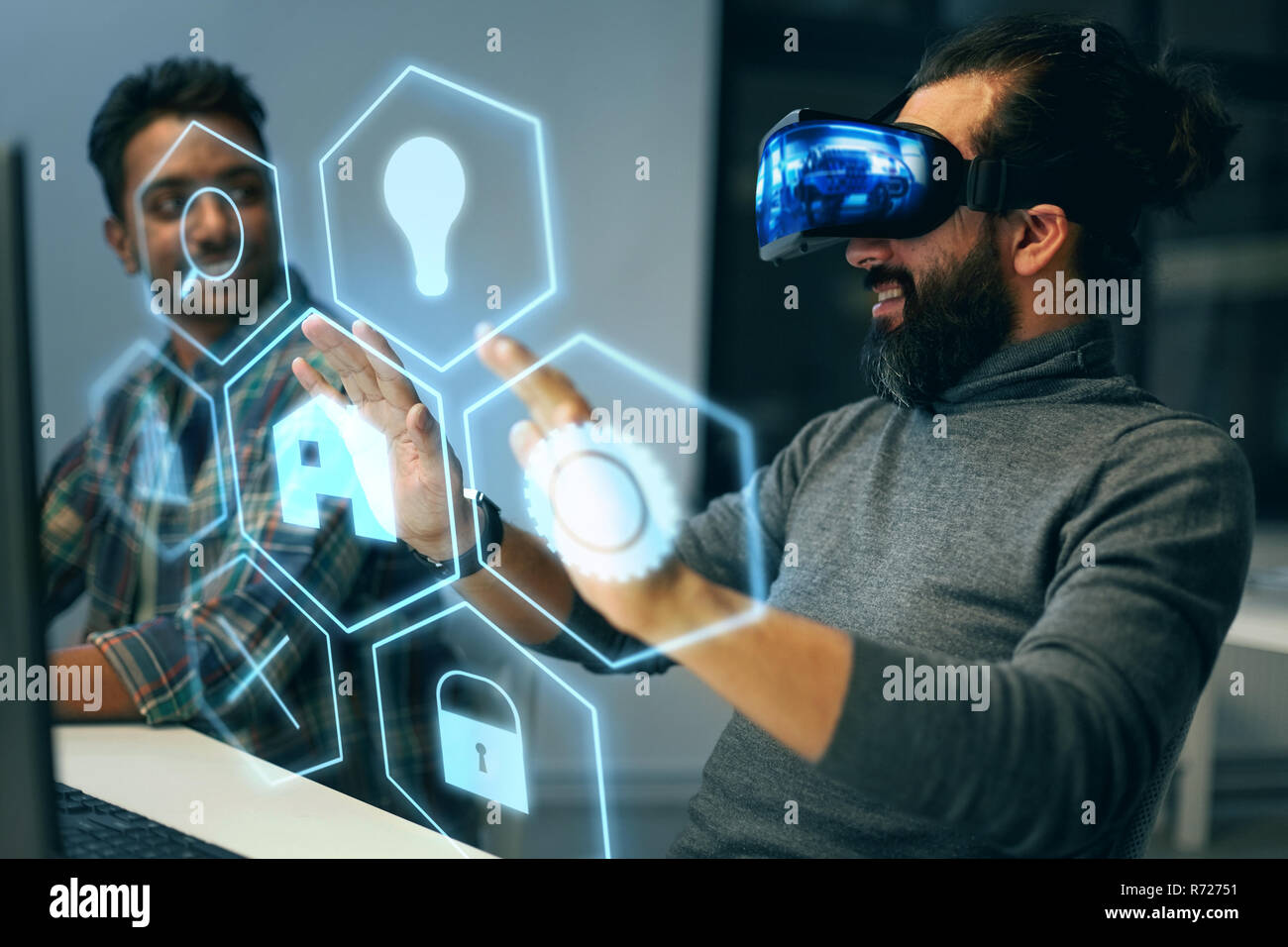 man in vr headset with virtual interface at office Stock Photo