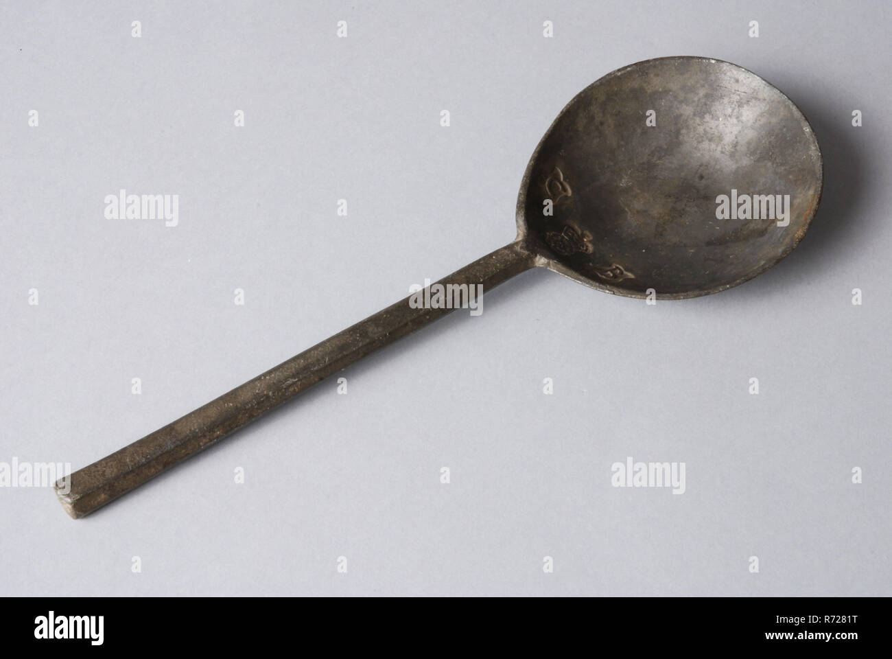 Tin spoon, almost round scoop blade, rose mark and initials C , spoon  cutlery soil find tin metal, cast Figs-shaped bowl small needle or rat tail  as transition to hexagonal handle with