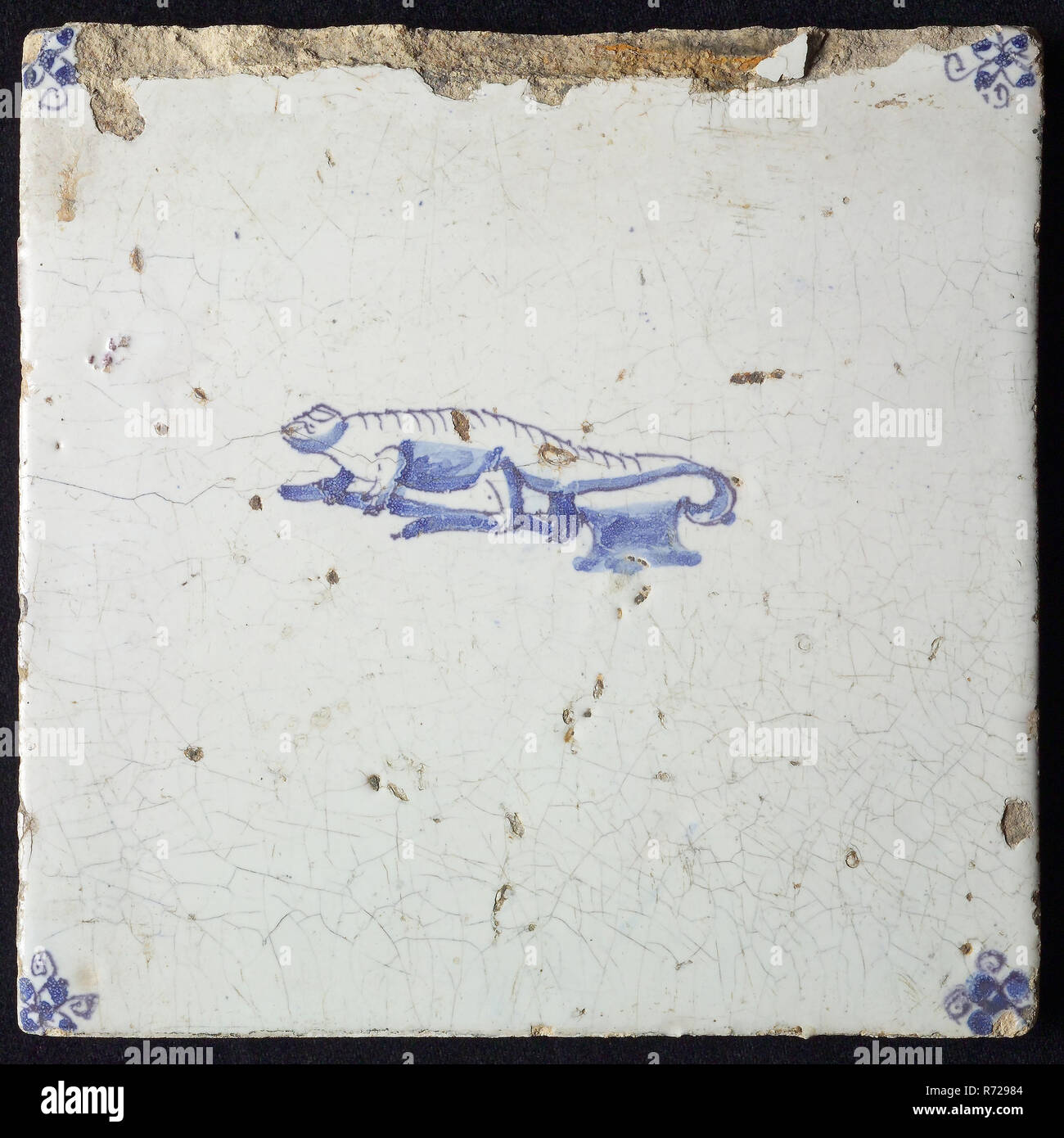 Animal tile, crocodile left, in blue on white, corner motif spider, wall tile tile sculpture ceramic earthenware glaze, baked 2x glazed painted Stock Photo