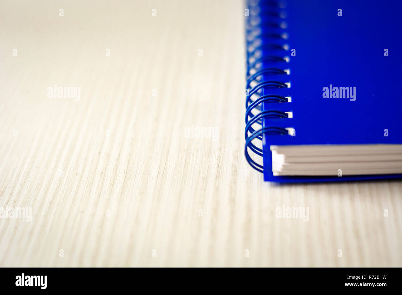 Spiral notebook isolated on a white table. Business and productivity concept. Spiral binding, stationery product Stock Photo