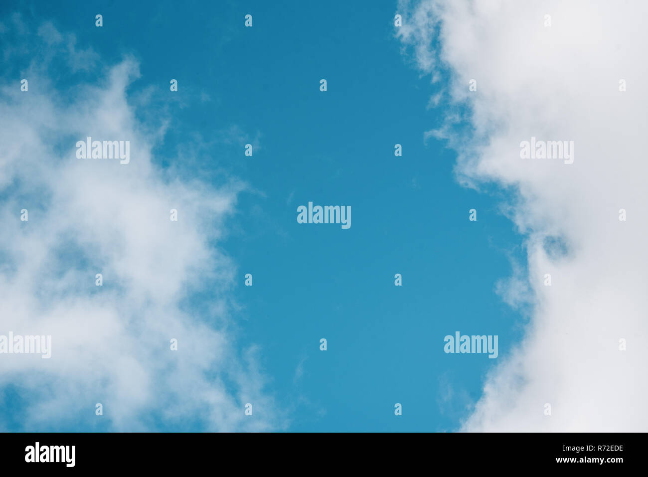 Blue sky with fluffy clouds Stock Photo