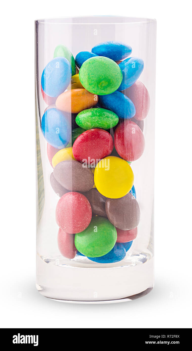 Сolored chocolate candies in a glass isolated on white background. Clipping Path. Full depth of field. Stock Photo