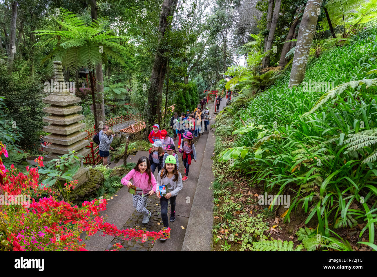 Madeira, Portugal - March 25, 2018: Group of children visiting the tropical garden of Madeira island in Funchal Stock Photo