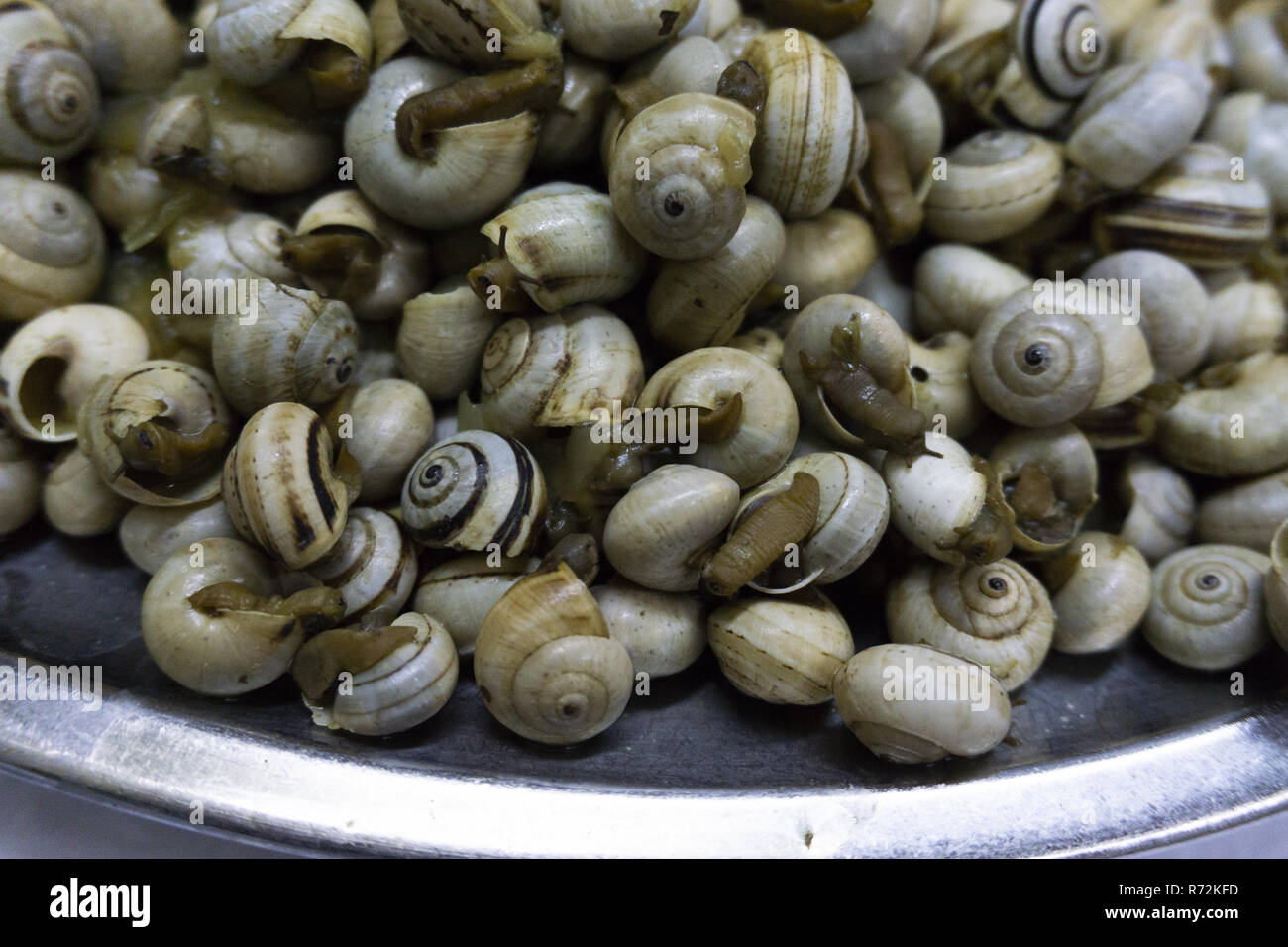 dish of boiled snails with garlic Stock Photo Alamy
