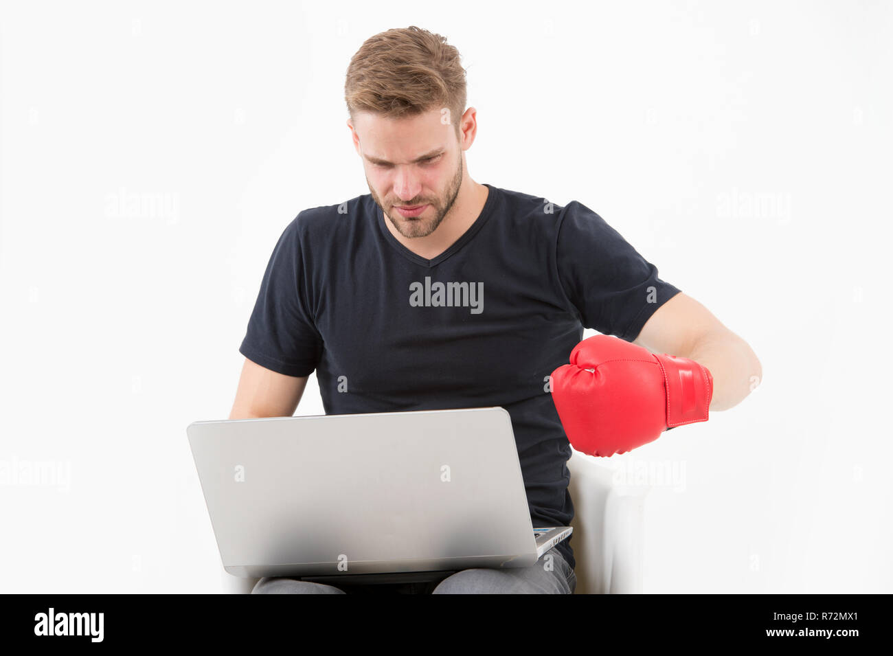 Man with laptop wear boxing glove isolated on white. Bearded man use computer for internet game. Sport bets and gambling online