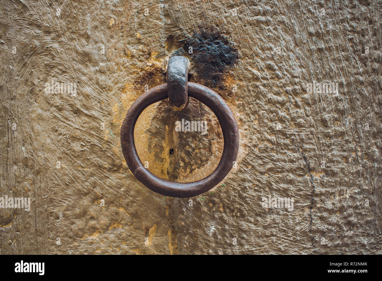 Door handles with an old double door. Golden Handle Door Entrance