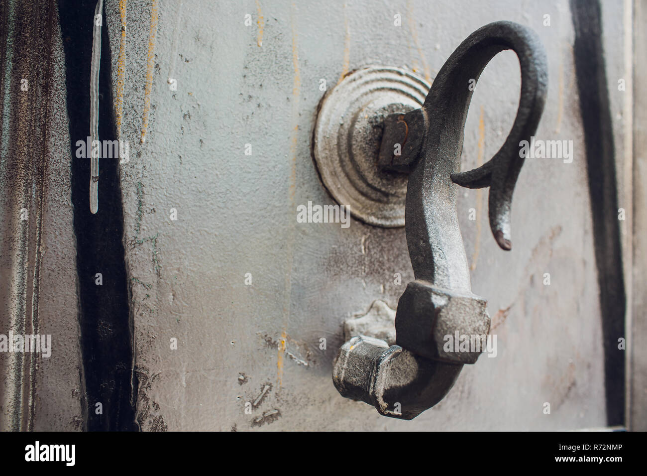 Door handles with an old double door. Golden Handle Door Entrance