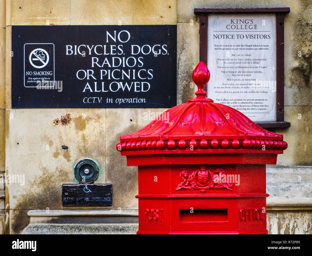 Vintage Postbox outside Kings College University of Cambridge - 1860s Grade II listed hexagonal Penfold Letter Box with VR initials Stock Photo