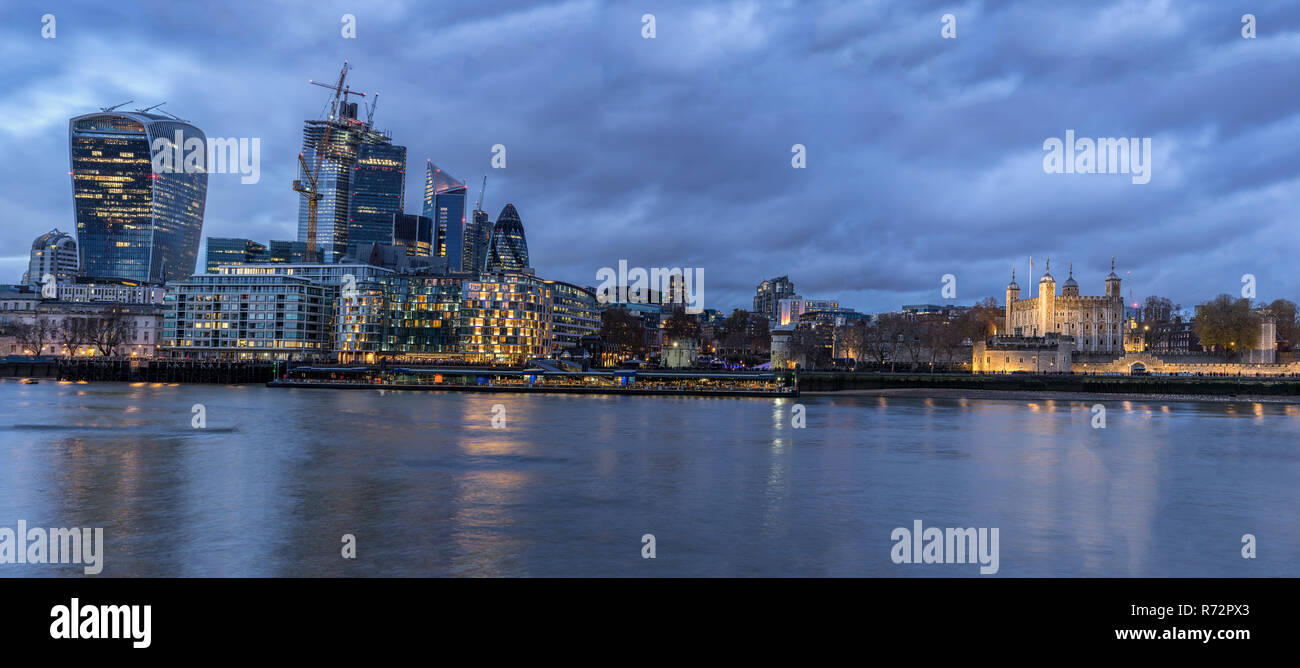 Looking across the River Thames to the river walk and the city in London Stock Photo