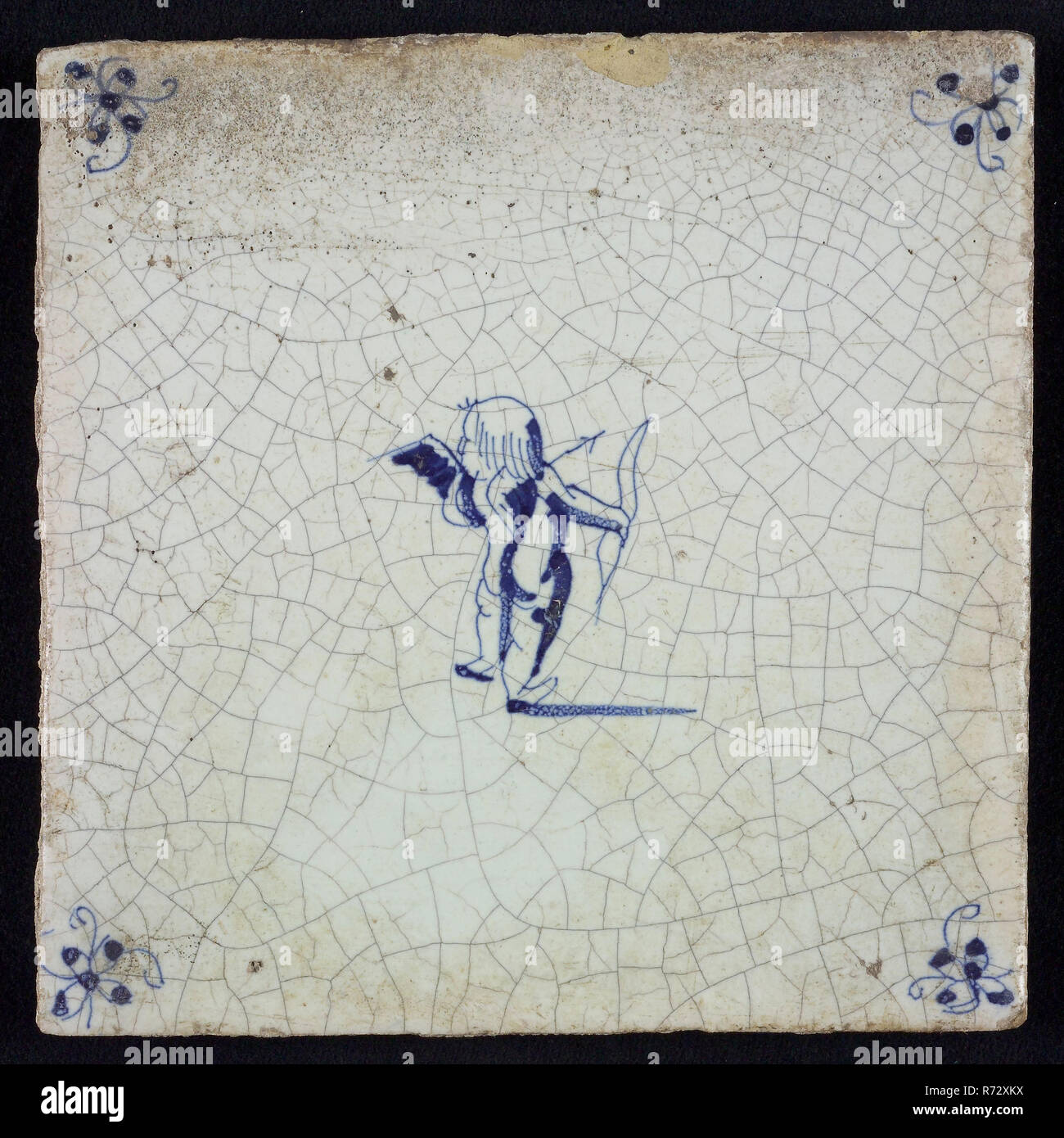 White tile with blue cupid with bow and arrow; corner motif spider, wall tile tile sculpture ceramic earthenware glaze, baked 2x glazed painted Stock Photo