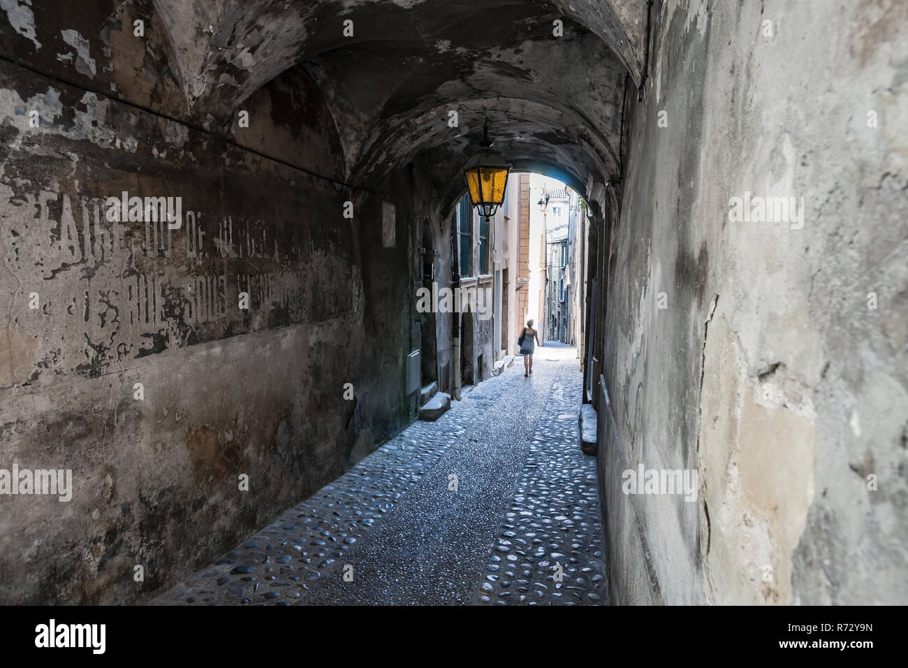 Covered arch passage in an old french medieval mountain village. An urban  look with a beautiful old streetlight and arcades in a narrow alley Stock  Photo - Alamy