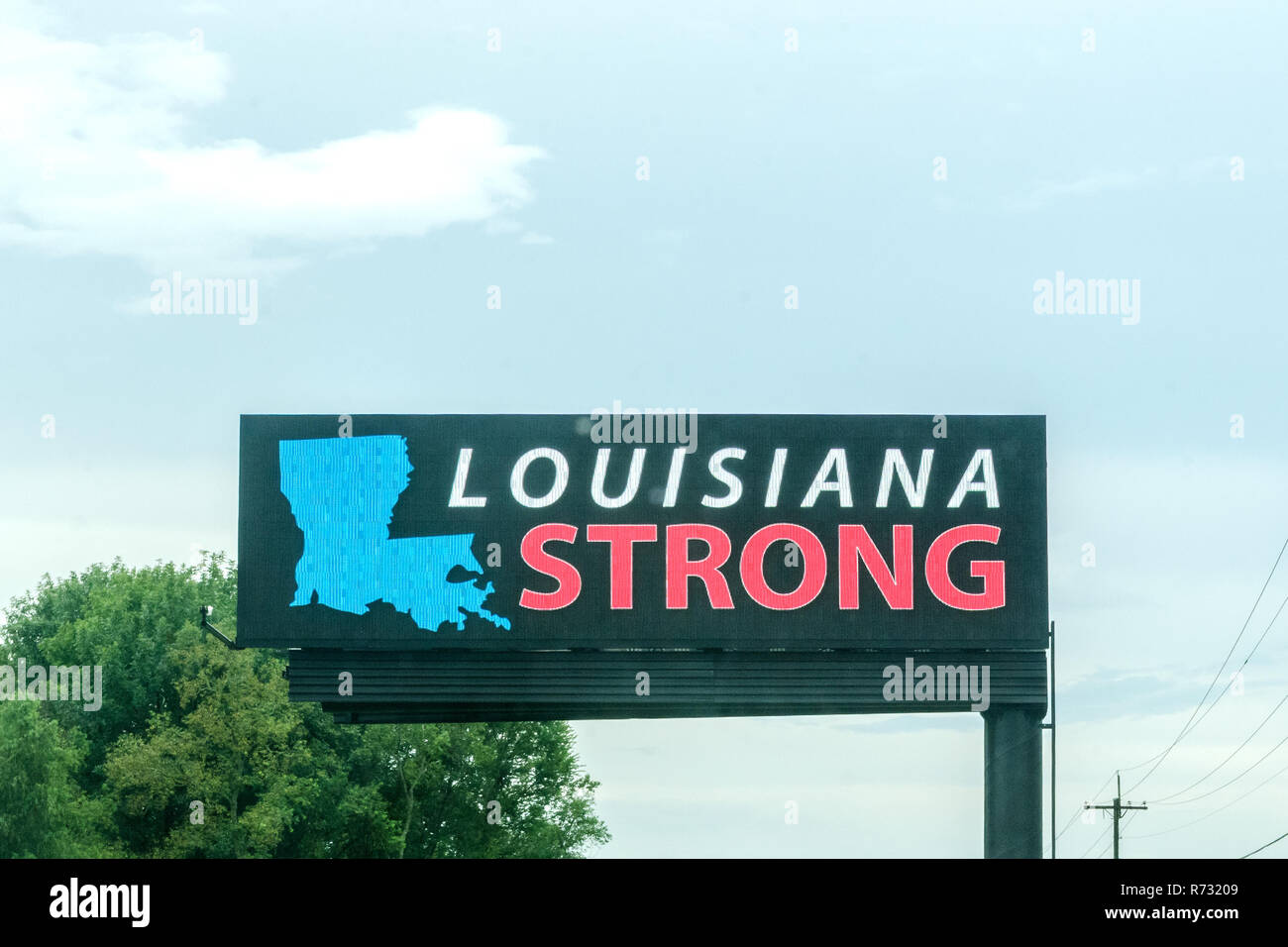 A sign reminds residents of Louisiana to stay strong after a flood, Aug. 25, 2016, in Gonzales, Louisiana. Stock Photo