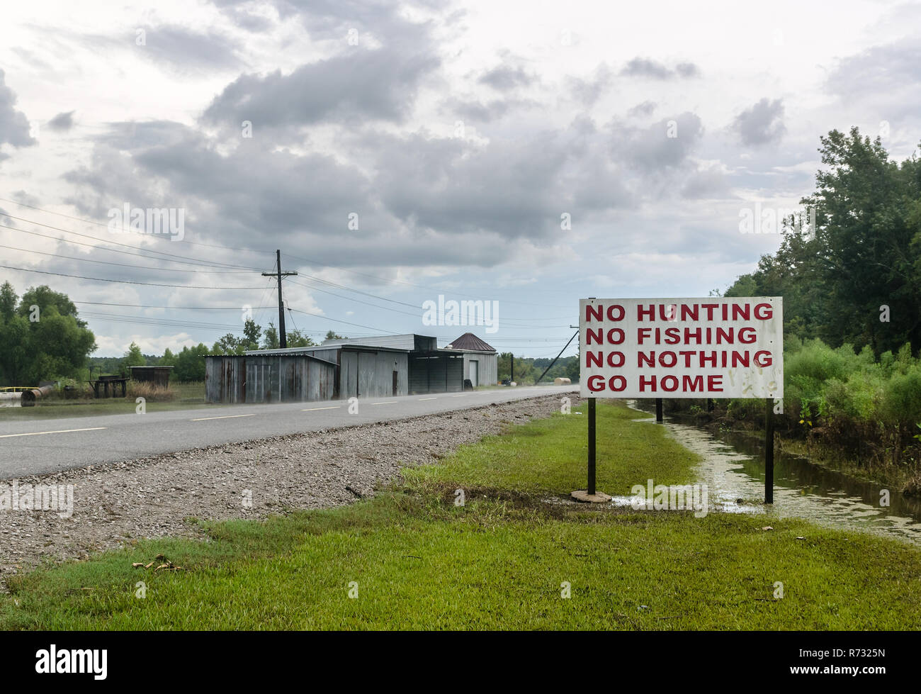 A sign discourages visitors at Motiva Enterprises, an oil refinery in Convent, Louisiana. Motiva also owns refineries in Norco, Louisiana, and Texas. Stock Photo