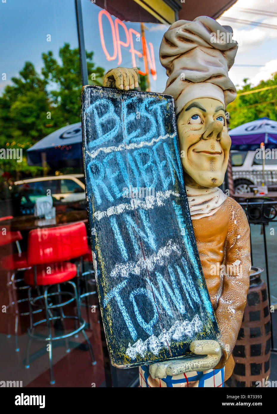 A statue holds a sign advertising the reuben sandwich at Chamblee Bistro in Chamblee, Georgia, May 20, 2014. Stock Photo