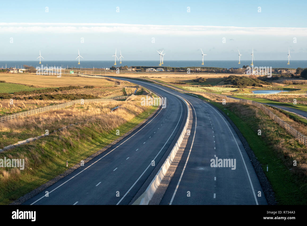 View of the new Aberdeen bypass road looking toward offshore wind farm Stock Photo