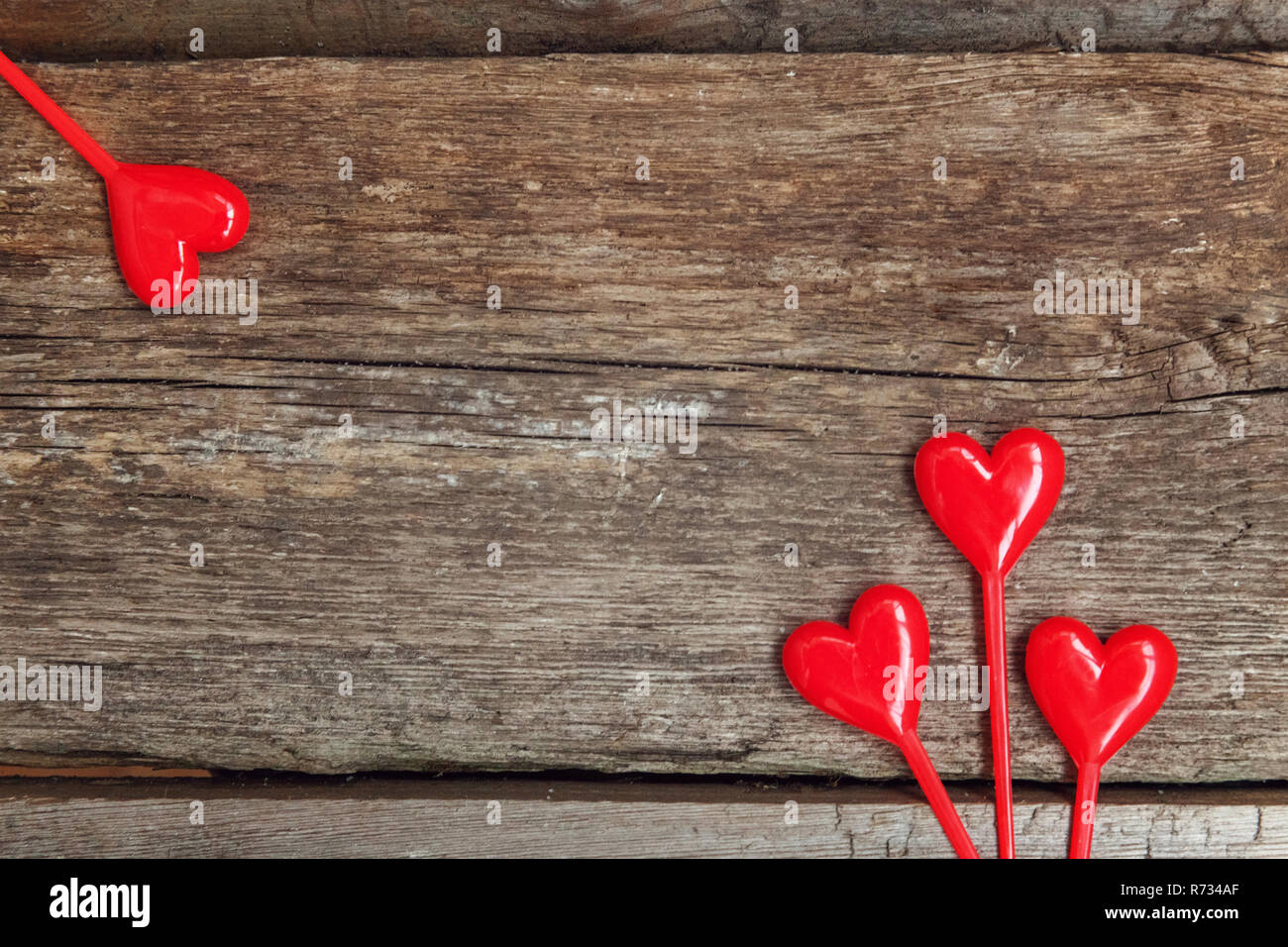 Valentine background concept with red hearts on rustic trendy old vintage  wooden background. Happy lovers day card mockup, copy space, top vew, flat  l Stock Photo - Alamy, image size:1300x956