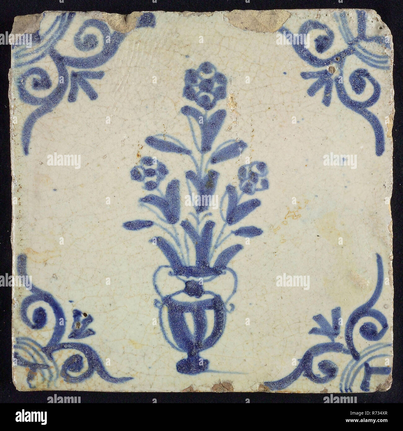 Flower tile, flowerpot in blue on white, corner motif large ox head, wall tile tile sculpture ceramic earthenware glaze, baked 2x glazed painted Red shard square Two double nail holes. Two-tone. Blue blue pull on white fond in blue paint on the back: roemer Stock Photo