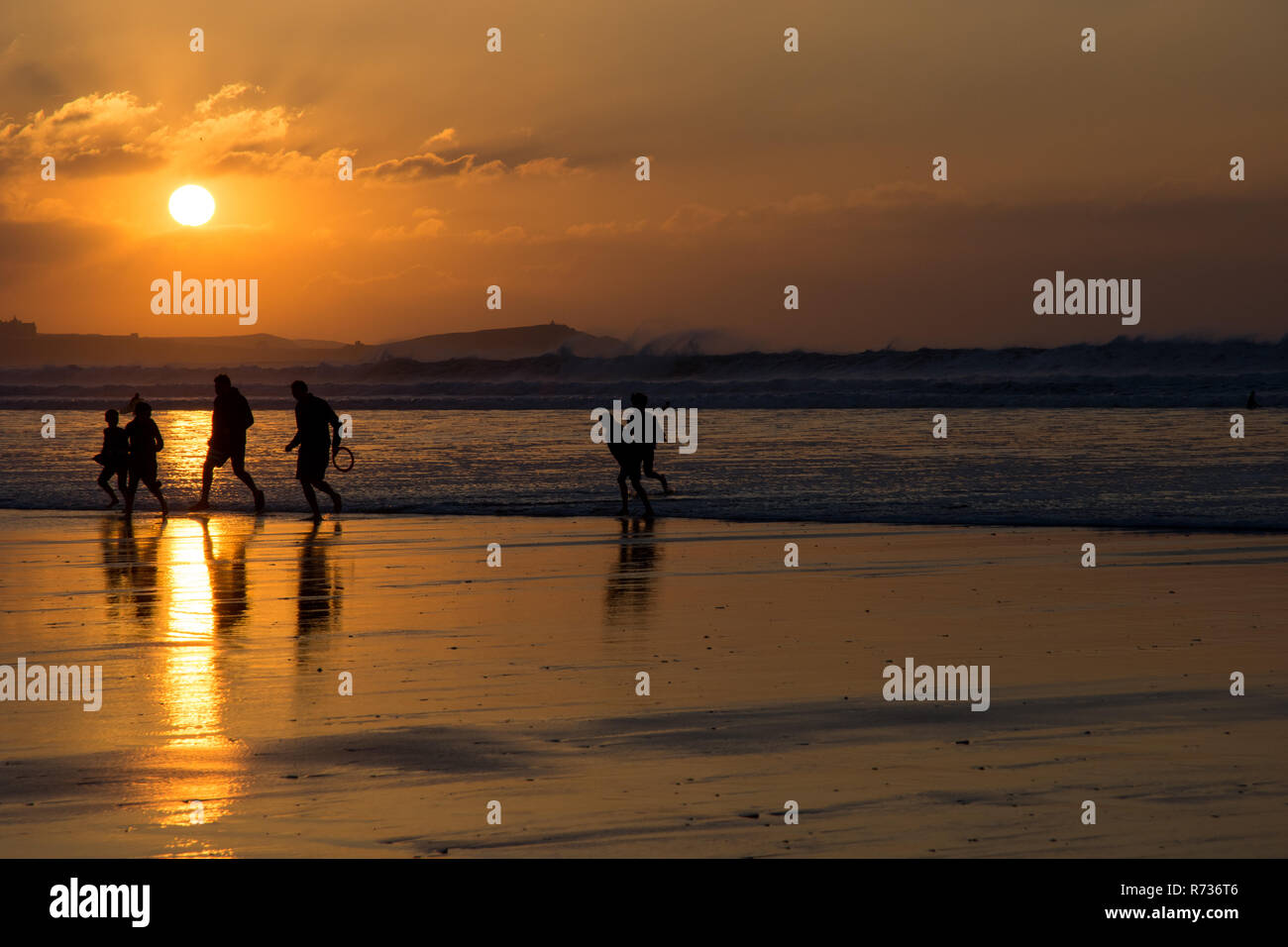 Winter evening sunshine on the beach at Watergate Bay, Newquay, Cornwall Stock Photo