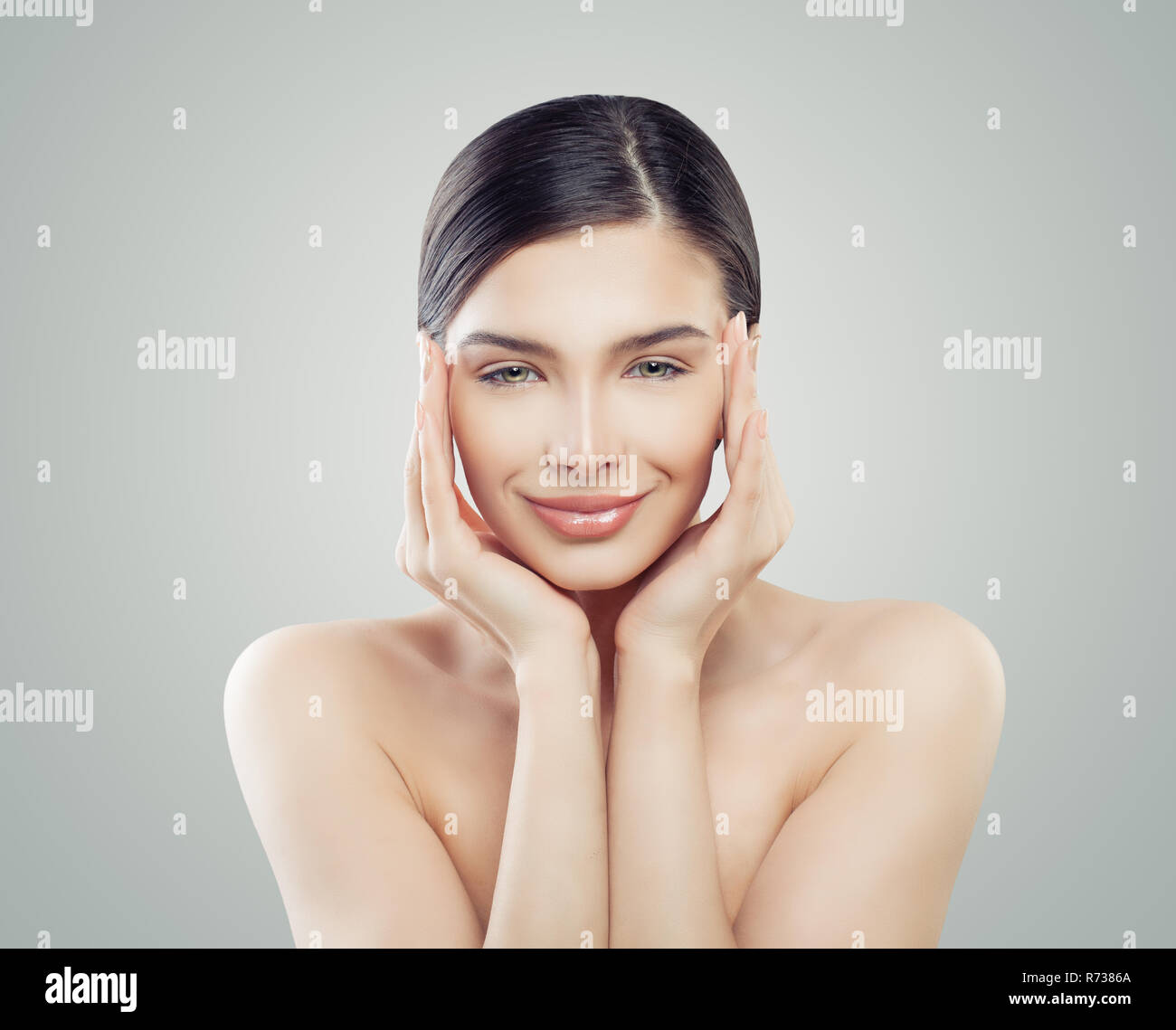 Cheerful woman spa model. Facelift, skincare and facial treatment concept Stock Photo