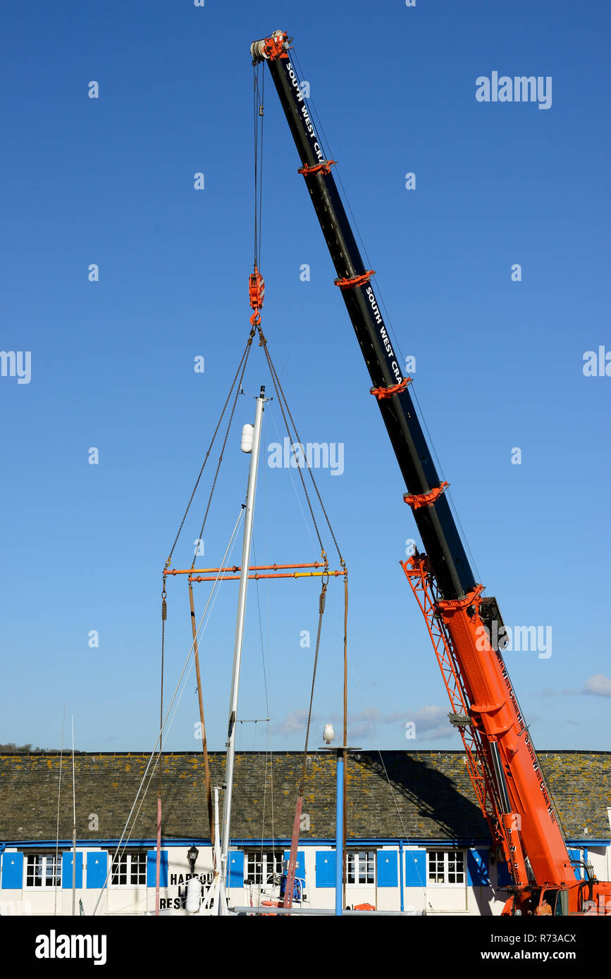 Crane being used to lift boats out of the water at Paignton Harbour
