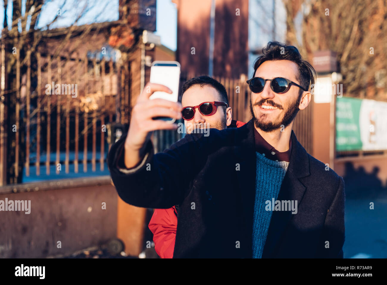 Friends taking selfie, Milan, Italy Stock Photo