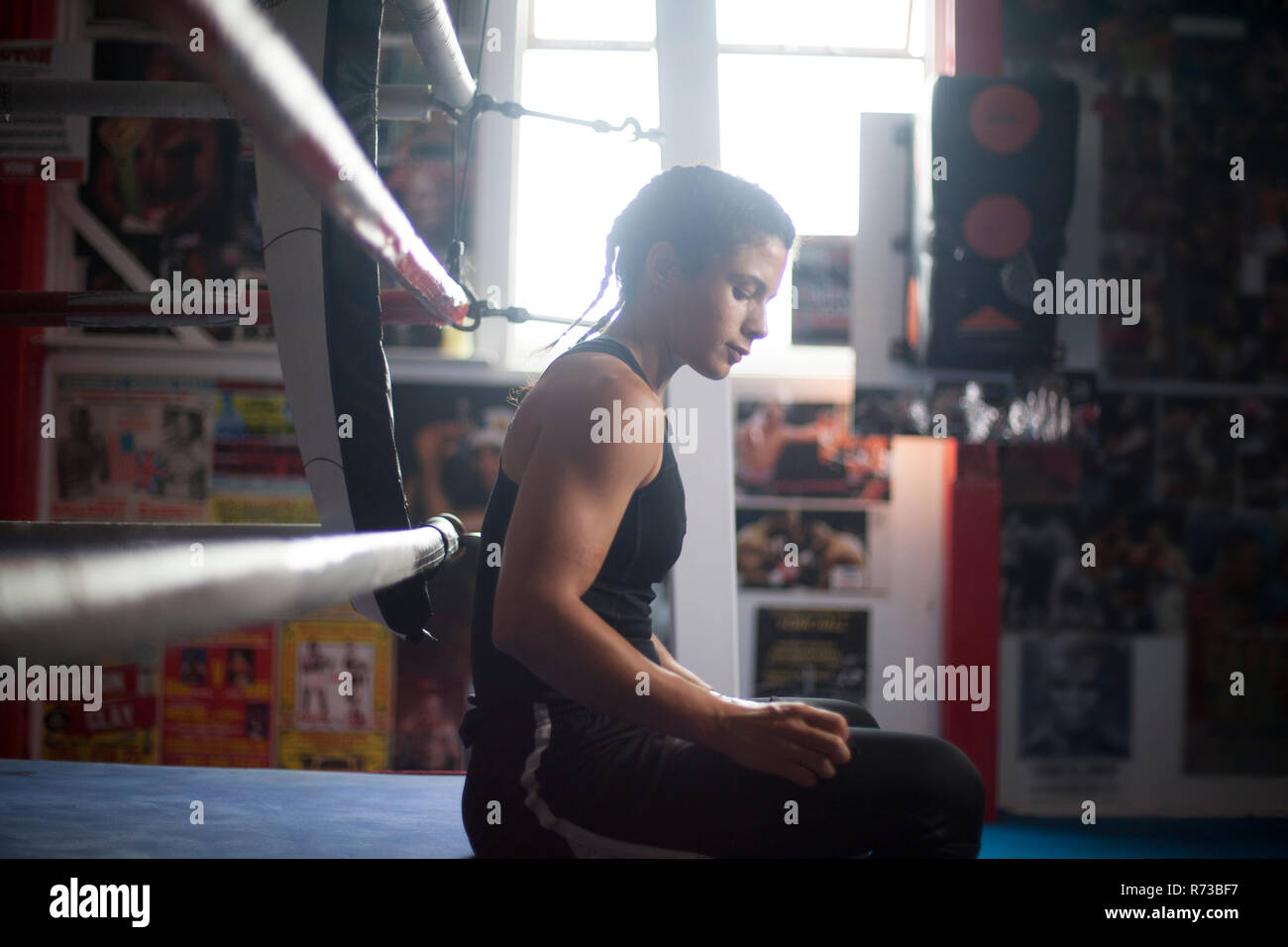 Female boxer by boxing ring Stock Photo