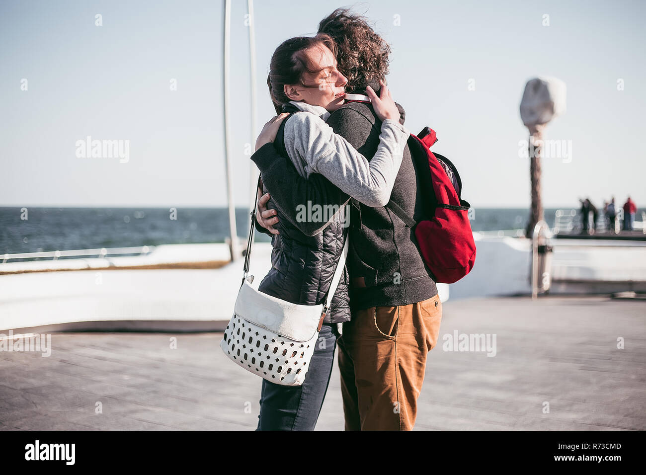 Couple hugging on sea waterfront, Odessa, Odeska Oblast, Ukraine Stock Photo
