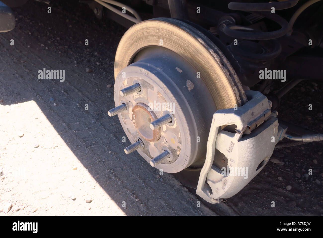 A truck wheel base sitting on the desert ground Stock Photo Alamy