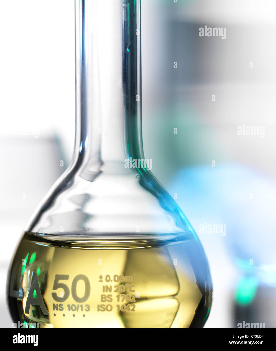 Laboratory beaker containing chemical formula Stock Photo