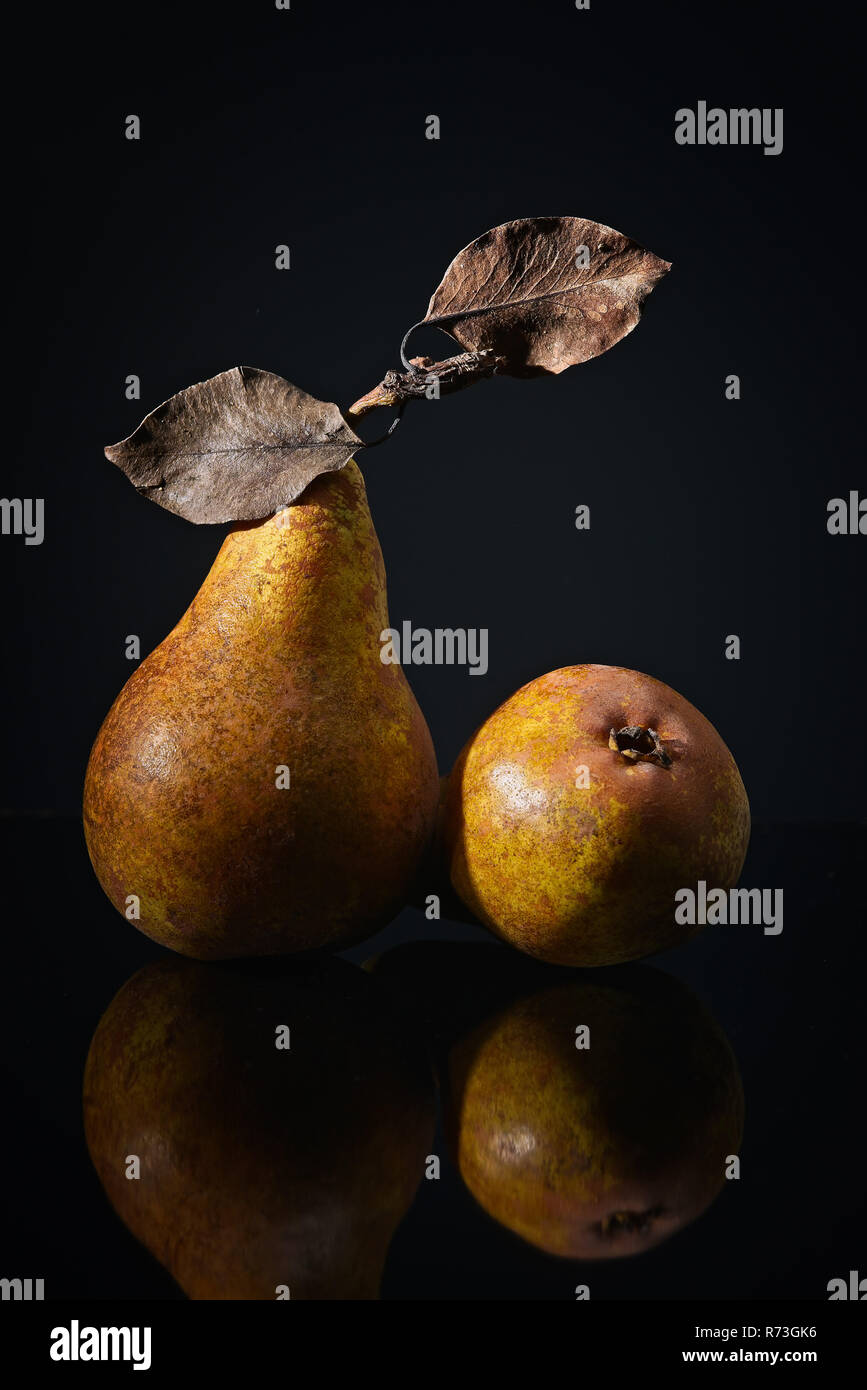 pears in front of dark background Stock Photo