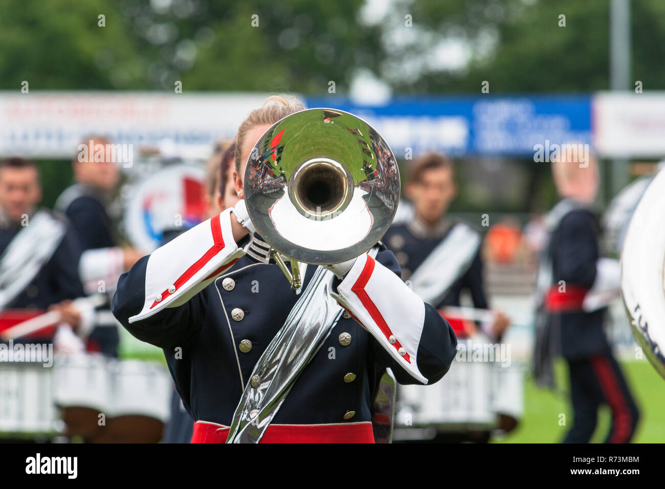 Marching band musician holding trumpet hires stock photography and