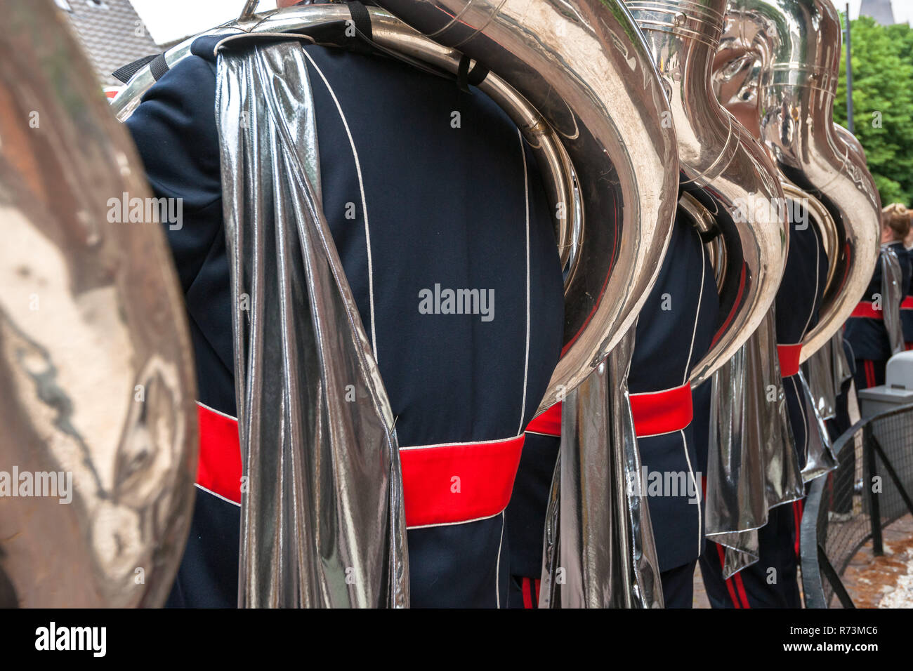 Details from a music, show and marching band. Playing musicians wind instruments in uniforms. Tuba, Sousa Stock Photo