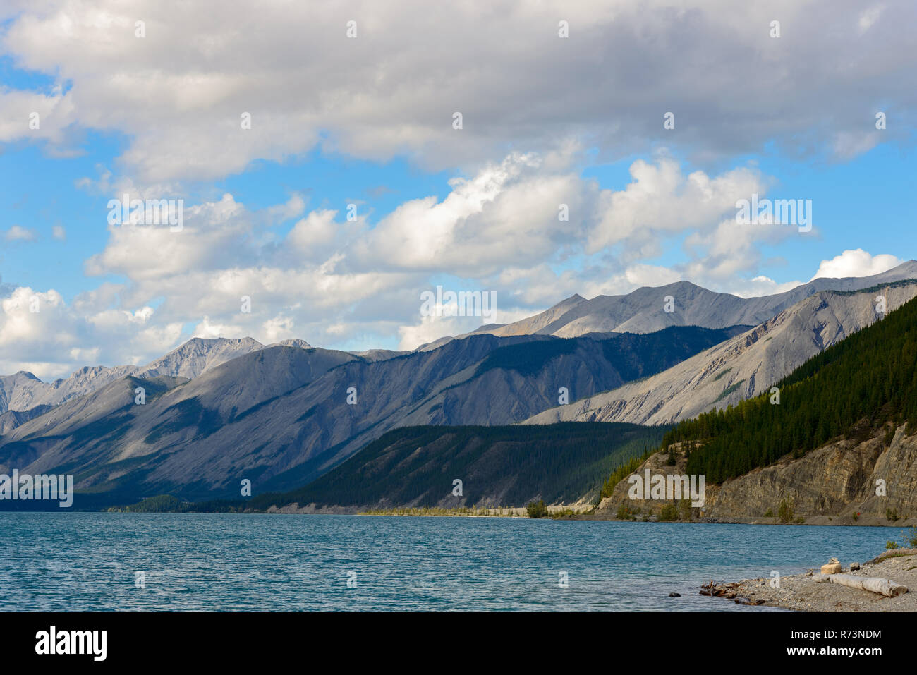 Mountains surrounding the lake at Muncho Lake Provincial Park, British Columbia, Canada Stock Photo