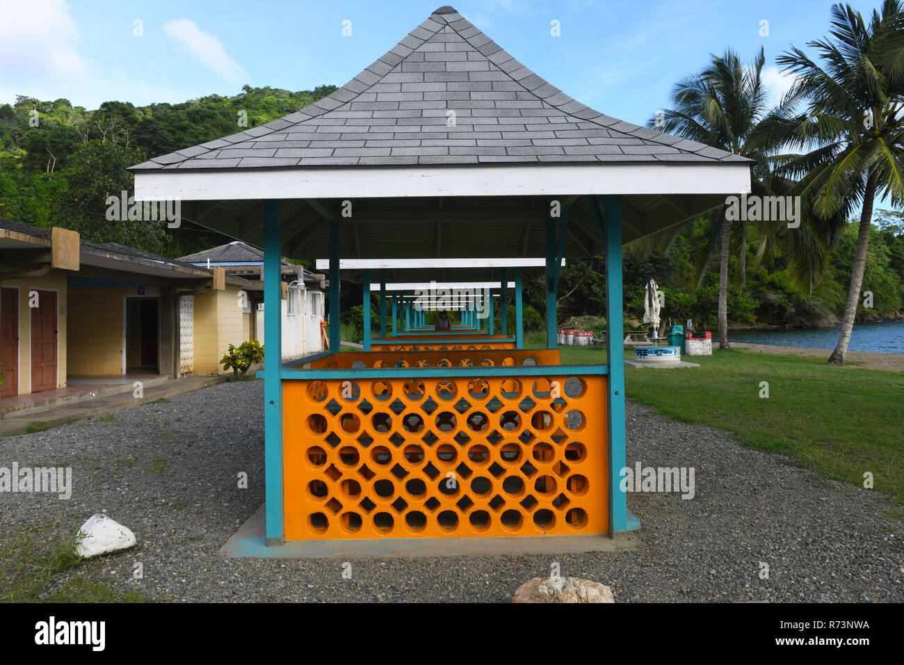 Well established picturesque beach resort with picnic, resting sheds and conveniences in northern Tobago around beautiful mountainous surroundings. Stock Photo