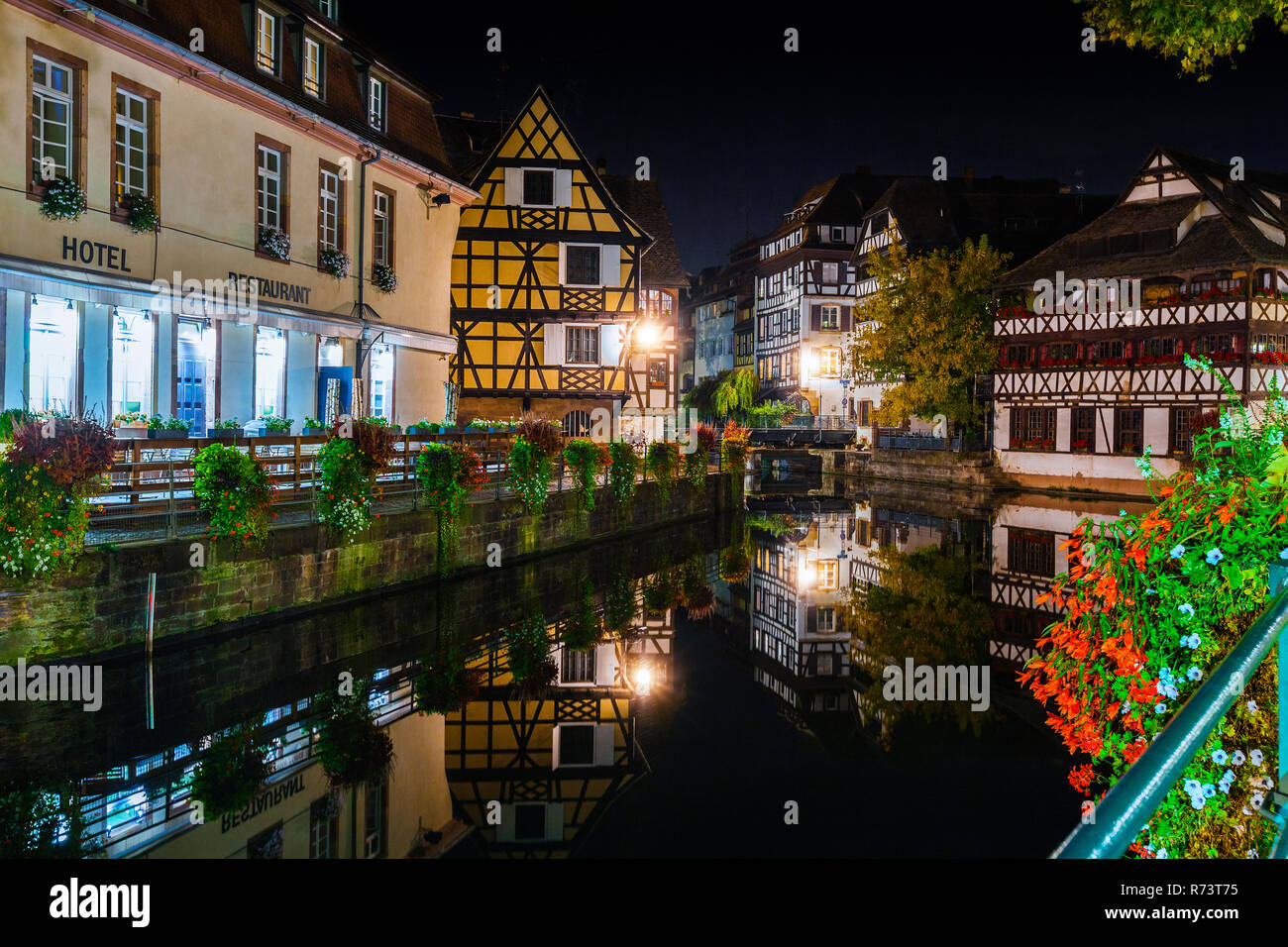 Historic half-timbered houses in tanners quarter in district la petite france in Strasbourg at night, Alsace, France Stock Photo