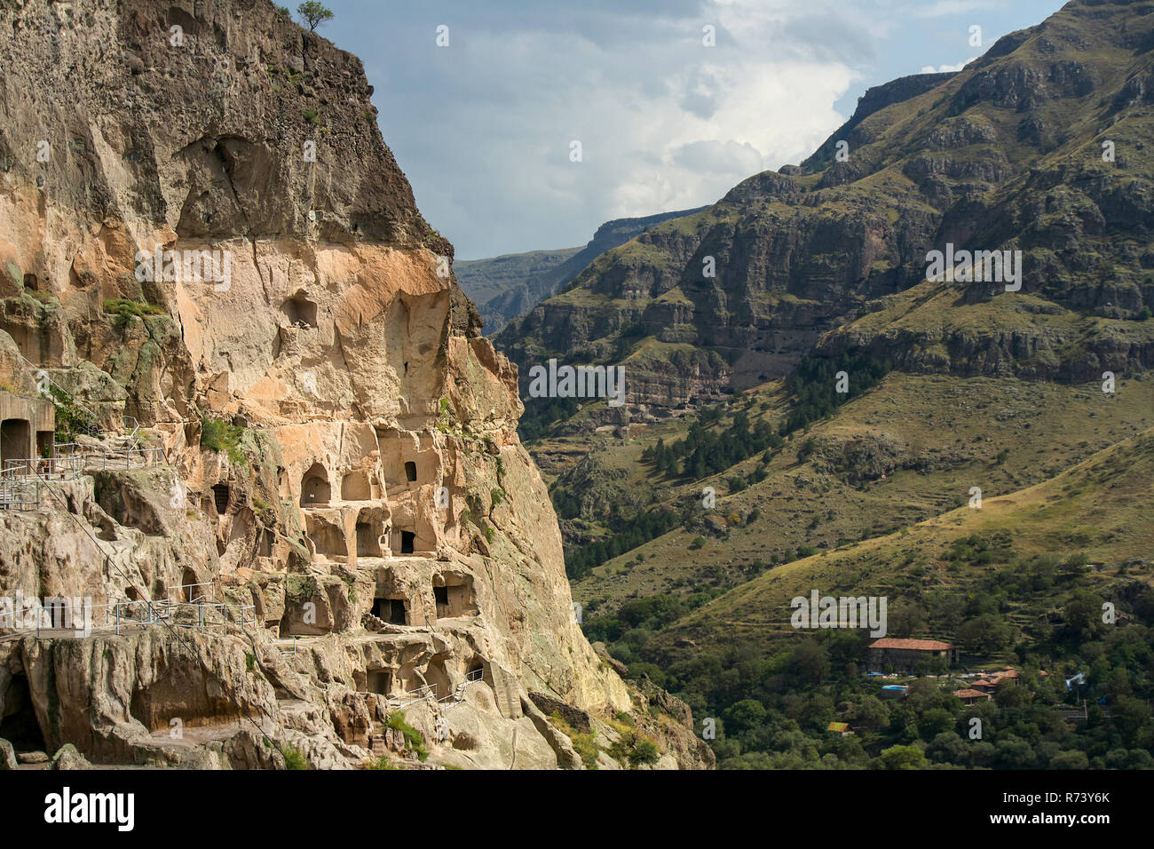 The 8th century Vardzia Cave City carved and chiseled in to the side of valley cliffs near the city of Akhaltsikhe, Georgia. Stock Photo