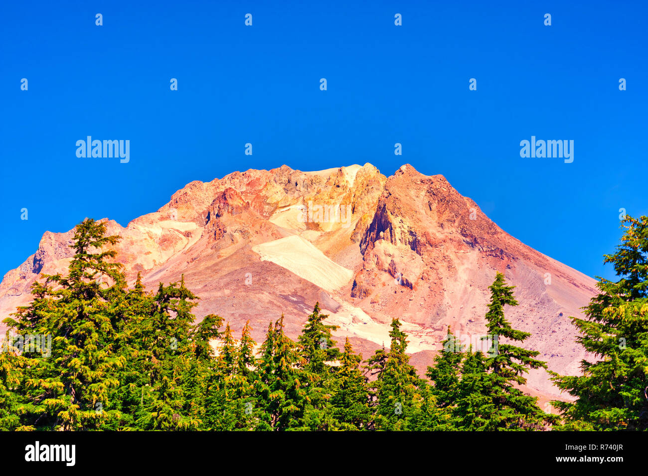 Mt. Hood shows it's structure during late summer the treeline in the