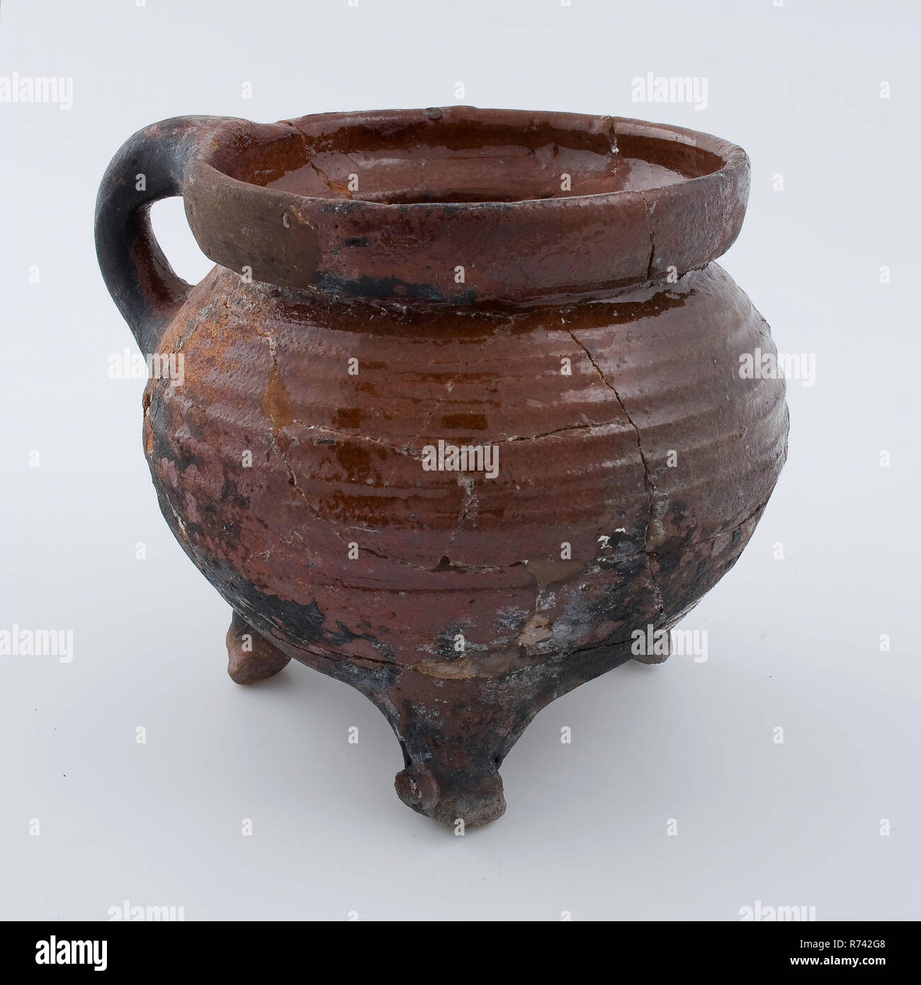 Small Pottery Cooking Jug With Rotations And Fire Stroke On Three